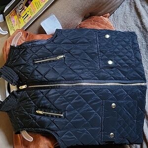 Copper Key Black and gold skirt vest accented with gold buttons and zippers